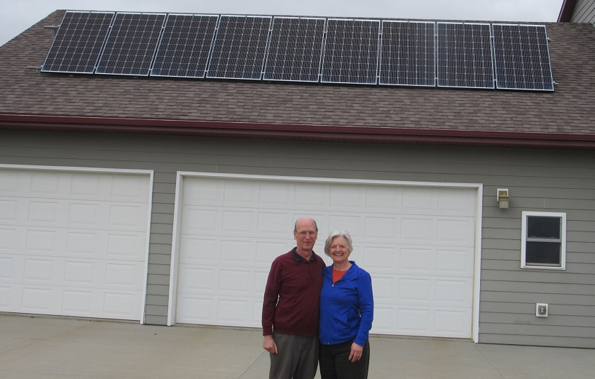 Dennis and Priscilla in their driveway